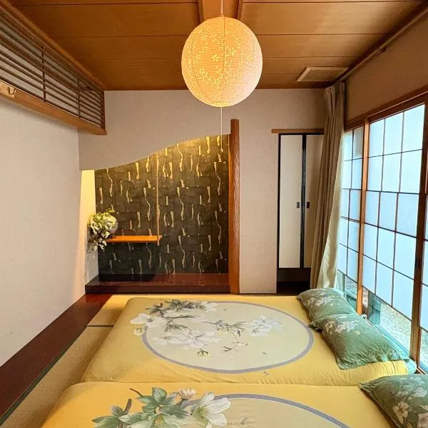 Just a short walk 心斎橋 Glico Sign 1min 道頓堀30-second 黒門市場 難波駅 Dotonbori Guesthouse 松の阁，位于大阪的酒店