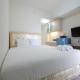 Minimalist Studio Room at The Springlake Apartment Sumarecon Bekasi By Travelio