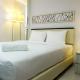 Studio Room Azalea Suites Apartment By Travelio