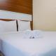 Compact Studio Room at Tamansari Papilio Apartment By Travelio Surabaya - Photo 1