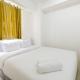 Simply Living 2BR at Bassura City Apartment By Travelio
