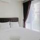 Pool View 3BR Apartment at Asatti BSD City By Travelio Tangerang - Photo 1