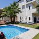 Eva & Dimitrios Villas, Captivating Oasis with Pools & BBQ, By ThinkVilla Panormos - Foto 2
