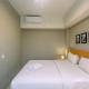 Luxury 1BR Apartment with Golf View at Mustika Golf Residence By Travelio, Cikarang