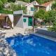 stone house Nikolina with heated Pool