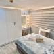 IV’s Condo w/ Netflix, Wifi & Karaoke, Cainta (foto 2)