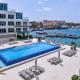 Stylish luxury condo, central location, ocean view, pool, gym Oranjestad - Foto 2
