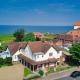 Overcliff Lodge, Mundesley sea view, sleeps 22 - Foto 1