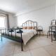 Peniche master bedroom with sea view balcony, private bathroom, shared kitchen, swimming pool, surfing resort, Atouguia da Baleia (photo 5)