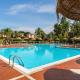 Apartments in residence with swimming pool in Santa Margherita di Pula, 250 meters from the sea, Пула