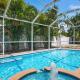 Bloom Lagoon! Tropical home with heated pool and grill! Pet Friendly!