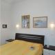 Modern flat in a fantastic residence with pool, Bibione - Fotografie 3