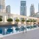 Stylish 1BR Apartment with City View Balcony Pool and Parking, Dubaï - Photo 1