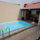 Casa Maravilhosa e Ampla Pé na Areia com Piscina, Área Gourmet com Churrasqueira em Deck Coberto Frente a Piscina, 4 Quartos Confortáveis e Espaçosos, Sendo 2 Suítes, Cozinha Americana e Sala de Jantar, Ampla Garagem para 6 Carros - Mercado na rua da Casa, Praia Grande - Foto 3
