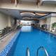 BirchTower Studio Condo with Balcony & Pool - Carosa Staycation, Manila - Foto 1