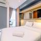 Minimalist and Comfy Studio Ciputra World 2 Apartment By Travelio, Jakarta - Photo 2