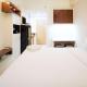 Compact and Cozy Stay Studio at Bale Hinggil Apartment By Travelio, Medokanayu - Fotografie 4