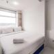 Spaicous 1BR with City View at Grand Asia Afrika Apartment By Travelio Bandung - Fotografie 1