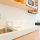 Cozy Living Studio (No Kitchen) Tokyo Riverside PIK 2 Apartment By Travelio, Rawalembang (Foto 6)