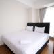 Simple and Clean 2BR at Grand Sungkono Lagoon Apartment By Travelio