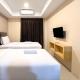 Comfy Studio Room at De Prima Apartment Medan Apartment By Travelio, Medan - Foto 1