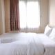 Simply Homey 2BR at 11st Floor Pinewood Apartment By Travelio