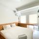 Best Homey Studio at Patraland Urbano Apartment By Travelio