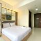 Minimalist Studio at Pollux Chadstone Apartment By Travelio Cikarang - Fotografie 5