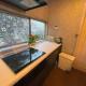 Tatami room & Living Room equipped with Multinational TV and Fire, BBQ corner in Tokyo Downtown House, Tokio - Fotografie 10