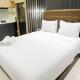 Warm Studio with Access to Mall at Anderson Supermall Mansion Apartment By Travelio Surabaya - Foto 1