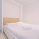 Cozy and Clean 2BR at Transpark Cibubur Apartment By Travelio, Depok - Fotografie 2