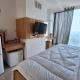7 min to ICE 1BR with Wifi, Netflix, AC, Kitchen, TV, Swimming Pool, Gym, Free Parking, Dadap