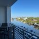 Luxury 2 Bed 2 Bath Waterfront Condo with Patio Sunsets Gym and Parking