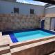 Casa com piscina em Itanhaem, イタニャエン - 写真 1