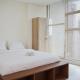 Comfort and High Floor Studio at Brooklyn Alam Sutera Apartment By Travelio, Tangerang - Fotografie 1