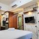 Homey and Comfy Studio at Vida View Makasar Apartment By Travelio, Pampang - Photo 3