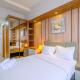 Cozy Living Studio at Evenciio Margonda Apartment near UI By Travelio