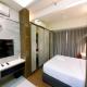 Cozy Studio Room at Uttara The Icon Apartment By Travelio Kejayan - Fotografie 10