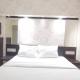 Comfortable Living 2BR at Dian Regency Apartment By Travelio, Surabaya (foto 2)