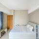 Homey and Nice 1BR at Gateway Park LRT City Bekasi Apartment By Travelio, Bekasi - Fotografie 2