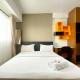 Comfy and Minimalist 1BR at The Wave Kuningan Apartment By Travelio