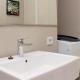 Warm and Cozy Studio at Azalea Suites Apartment By Travelio, Cikarang (Foto 5)