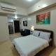 Roomy Condotel Across NAIA TERMINAL 3, Manila - Fotografie 4