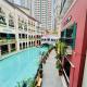 Cozy Staycation Venice with Balcony Mckinley near Bgc Manila - Photo 1