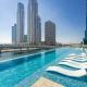 FAM Living Contemporary 2BR Oasis Waterfront Comfort Close to Downtown, Dubaj - Fotografie 1