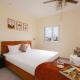CandlePine Suites - Khách sạn căn hộ
