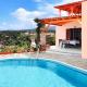 Villa Sunset with stunning sea view, kids area and hammocks on roof terrace, Agia Triada