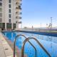 1BR Waters Edge with Canal Views Pool Access Near Attractions Abu Dhabi - Photo 2
