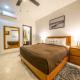 Condo Surf 405 - Luxury Oceanview Beachfront 3 BR with Gym - At El Faro Condos Playa del Carmen - Fotografie 9