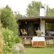 Unique House Surrounded By Willow Trees